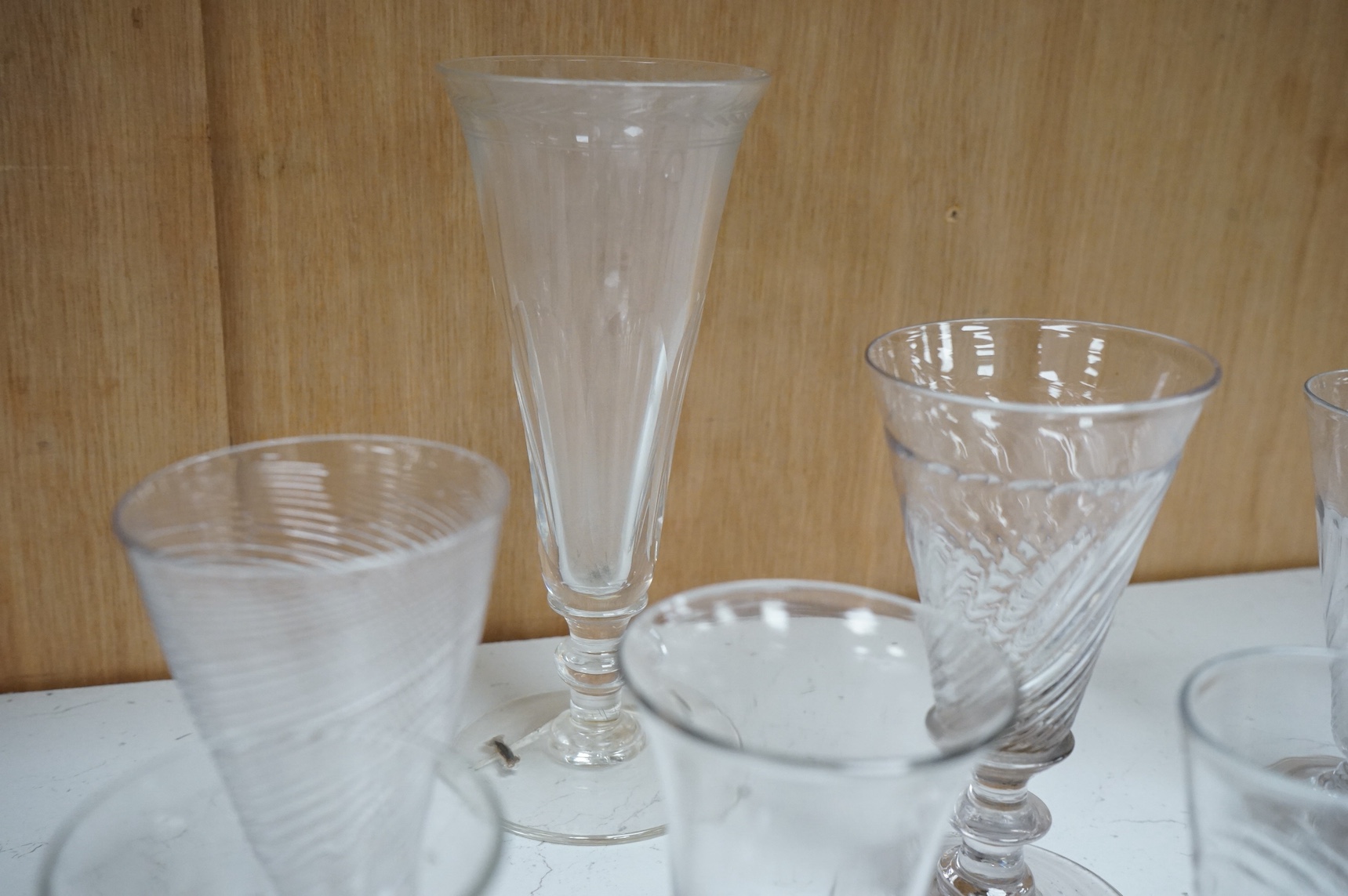 Ten 18th century and later drinking glasses, some with wrythen stems, largest 18cm high. Condition - mostly fair/good